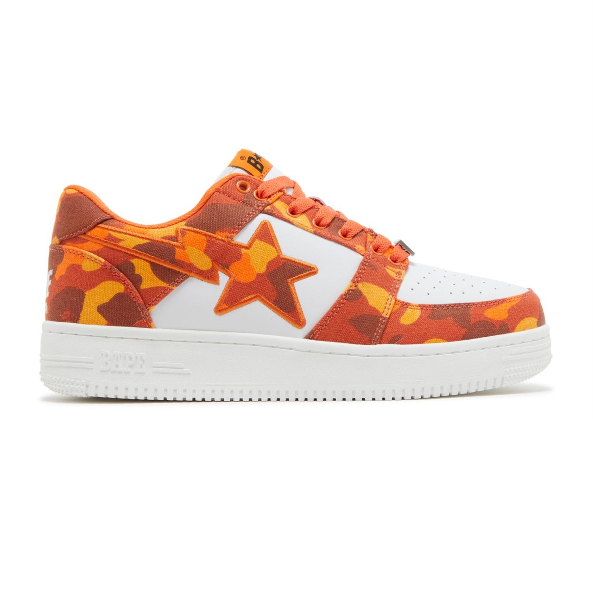 Sneaker with orange and white design on a white background